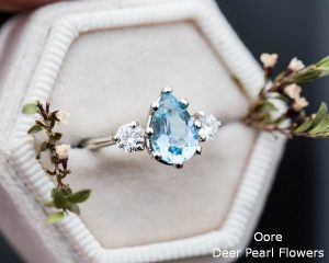 Aquamarine pear moissanite and 14k gold twig engagement ring