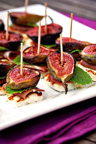 Fresh grilled figs brushed with honey and stacked with fresh mint Parma ham and halloumi