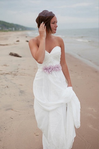 classic beach sweetheart wedding dress with purple flower belt