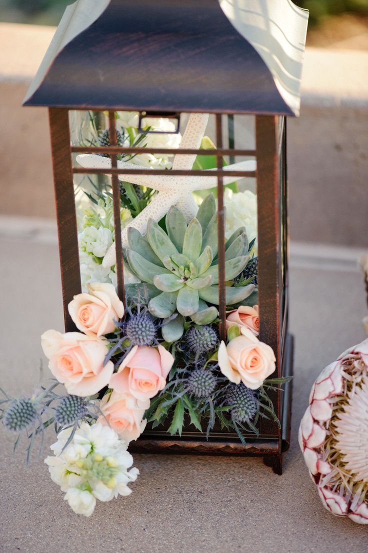 coral pink roses and succlent wedding centerpiece