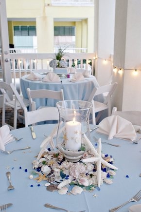 light blue beach themed candle centerpiece ideas for wedding