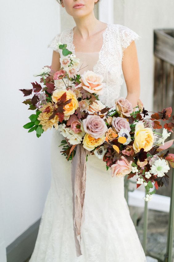 Anemone, dahlia and rose fall hued wedding bouquet