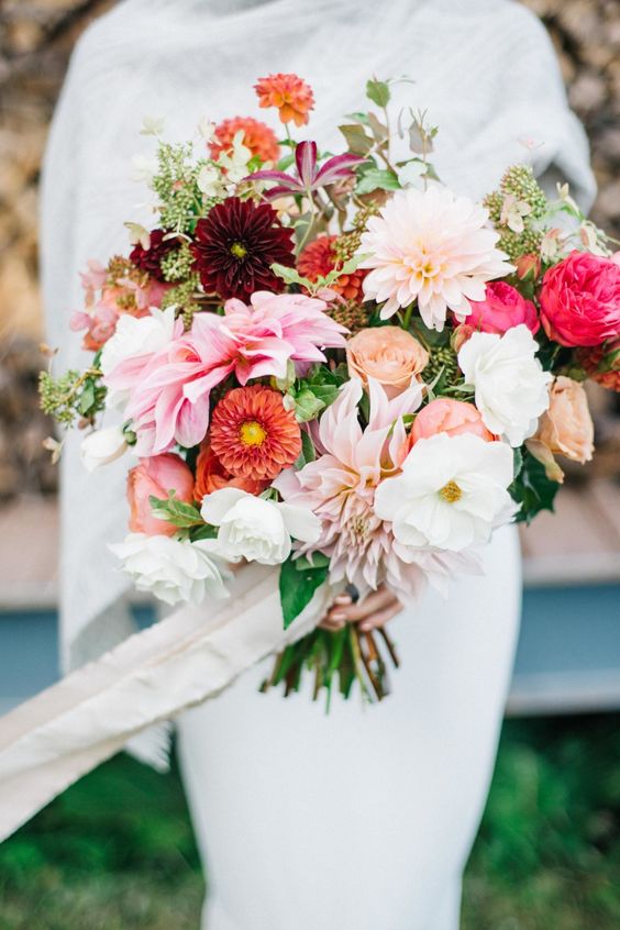 Anemone, dahlia, peony, and ranunculus wedding bouquet