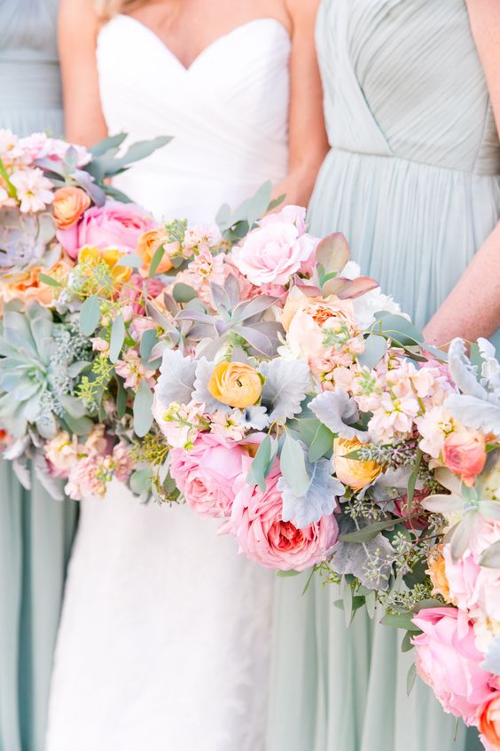 Colorful dusty miller and ranunculus wedding bouquets