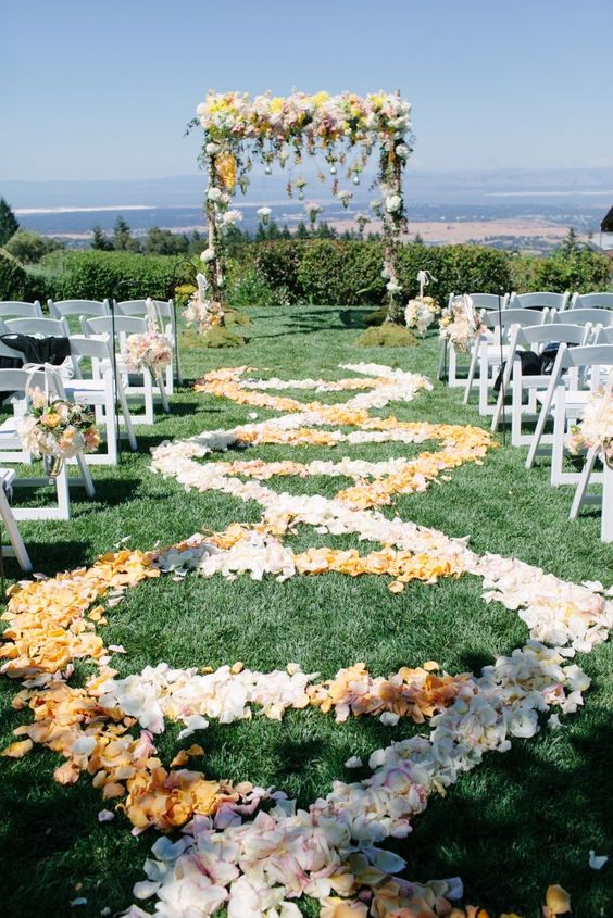 pastel yellow wedding arch via Meg Perotti Photography