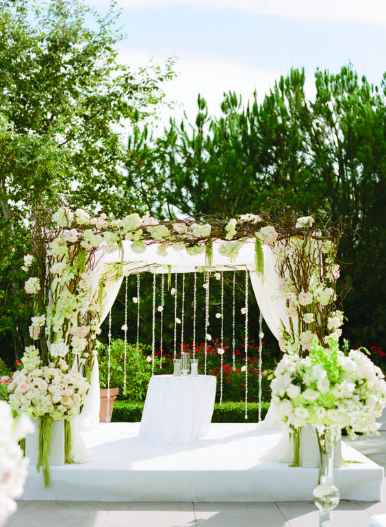 rustic green wedding arch via Marisa Holmes Photography