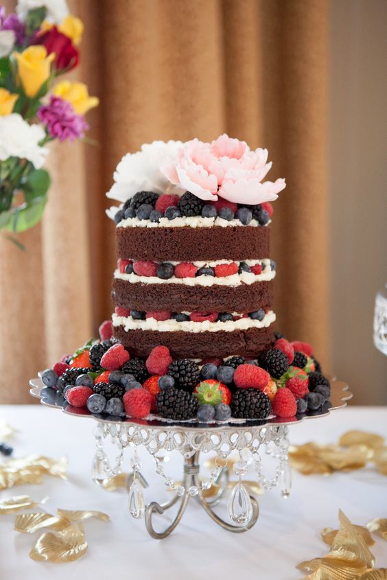 rustic naked wedding cake with berries